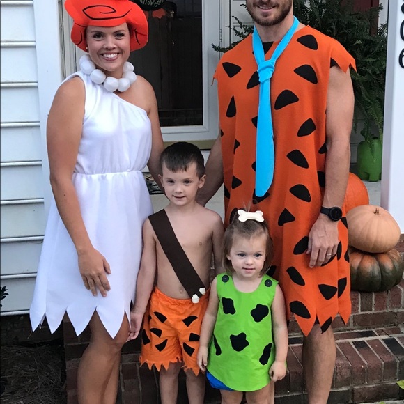 family of 4 Halloween costume with the Flintstones
