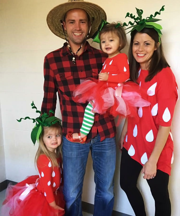 family of 4 Halloween costumes with farmer and DIY strawberries