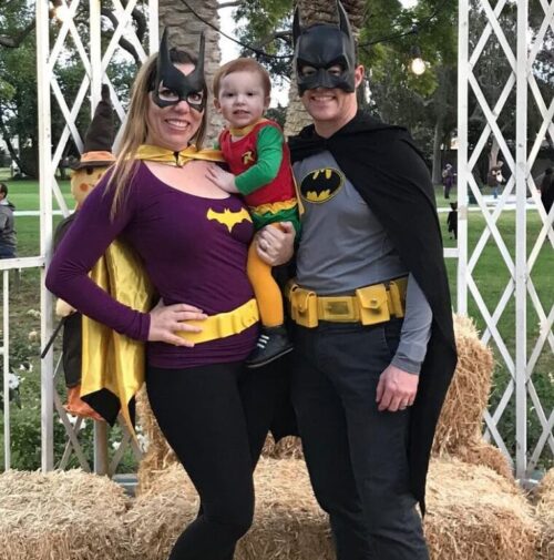 family of 3 Halloween costumes with Batman, Batgirl, and Robin
