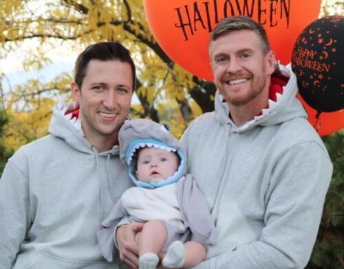 cute shark family Halloween costume idea for gay dads with a baby